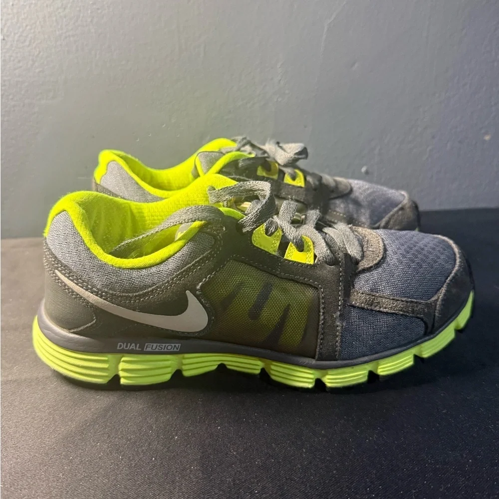 Nike women’s Gray and Neon Green Dual Fusion Sneakers